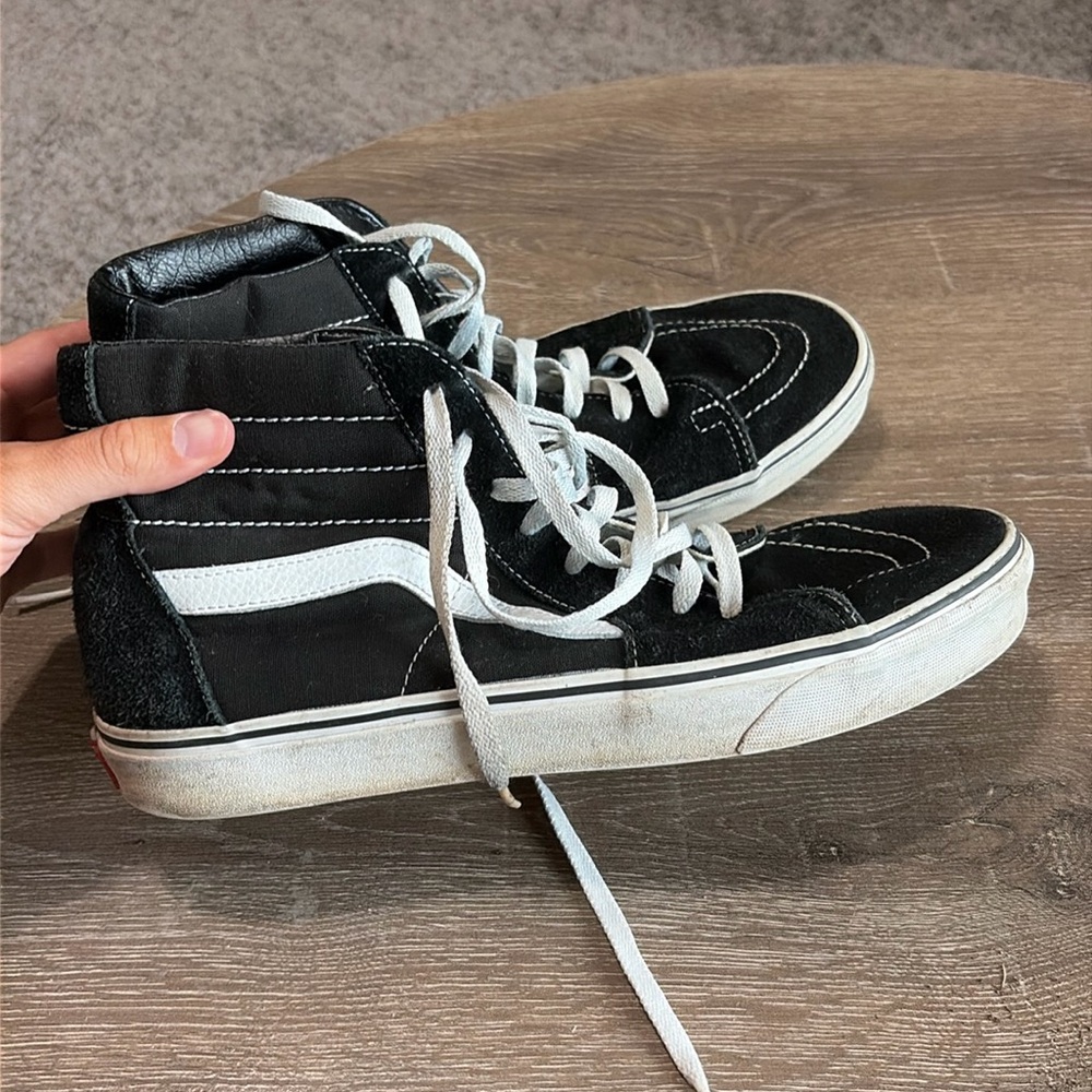 Black and White Vans High Top.